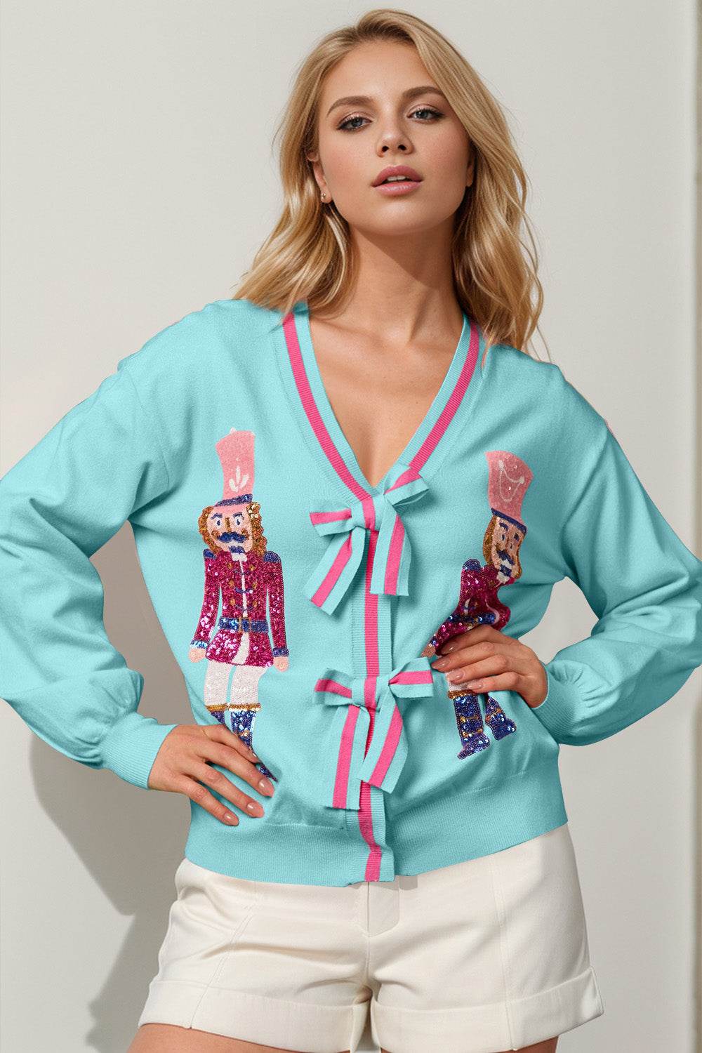 Double Take Full Size Nutcracker Sequin Bow Decor Cardigan Pastel Blue for a perfect OOTD – dress to impress outfits from Amexza